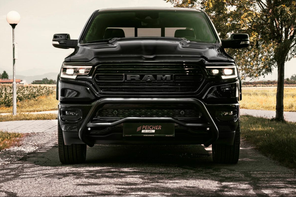 Front view of a black bullbar installed on a black Dodge Ram DT