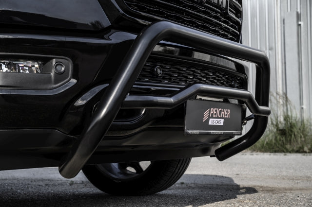 Close up view of a black bullbar installed on a black Dodge Ram 2019-2024