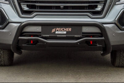 Closeup of a black bullbar installed on a GMC Sierra truck